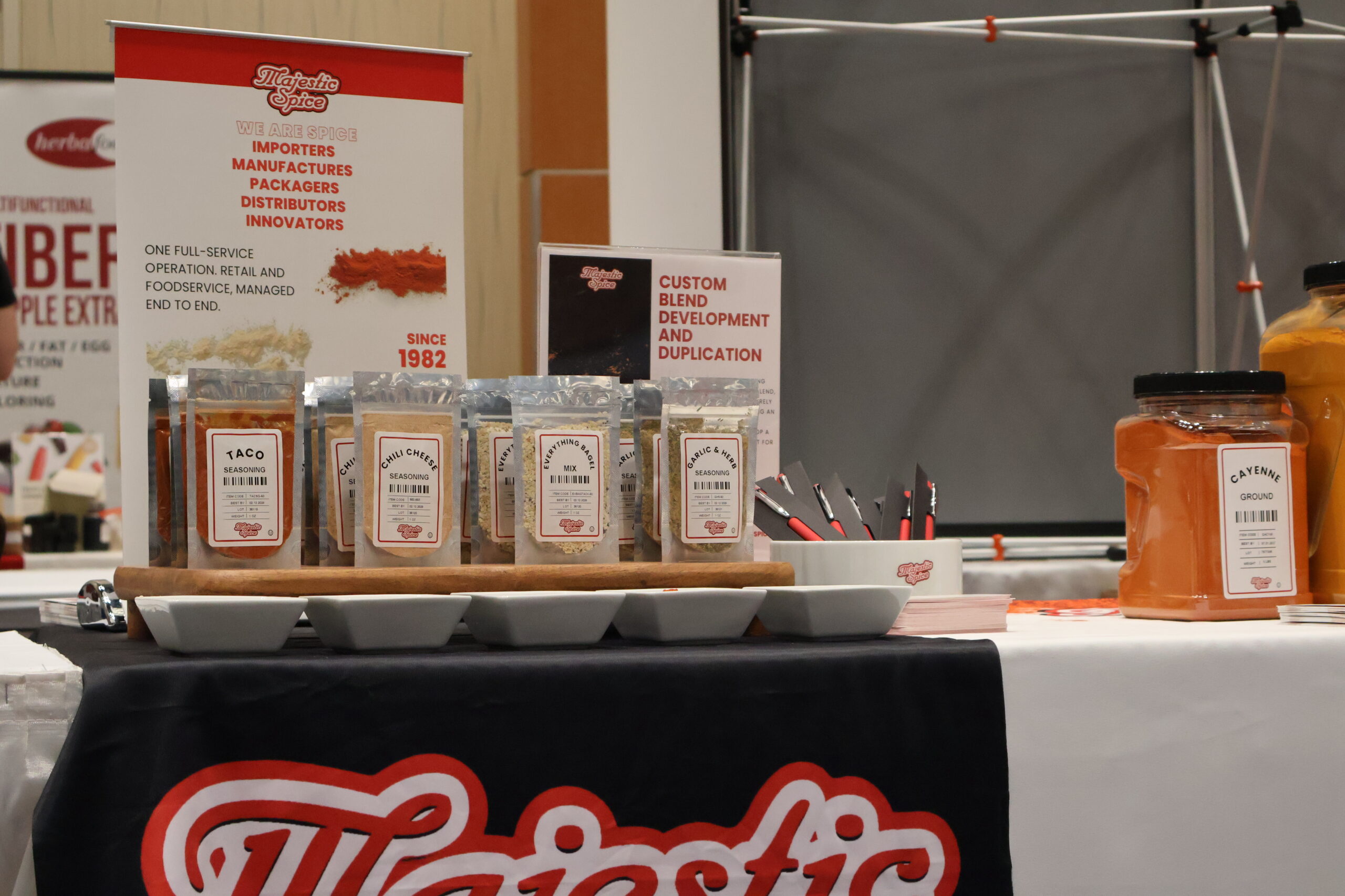 Shipping port with cargo containers and spice sacks in the foreground, representing global spice imports.