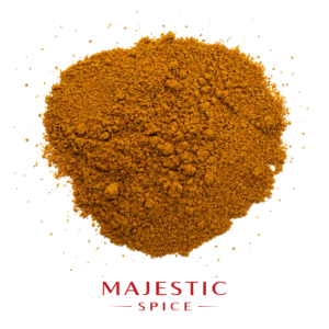Mound of hot curry powder with visible coarse granules, scattered spice particles, and the red Majestic Spice logo below.