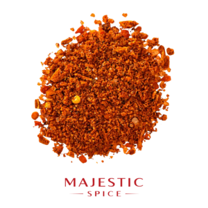 Mound of coarse reddish-orange BBQ mesquite seasoning with visible spice flakes and granules, with the red Majestic Spice logo below.
