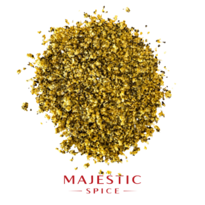 Mound of coarse lemon pepper seasoning with yellow citrus granules, black pepper pieces, and scattered particles, with the red Majestic Spice logo below.