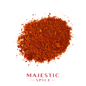 Mound of coarse reddish-orange taco seasoning with visible spice flakes and granules on a white background, with the red Majestic Spice logo below.